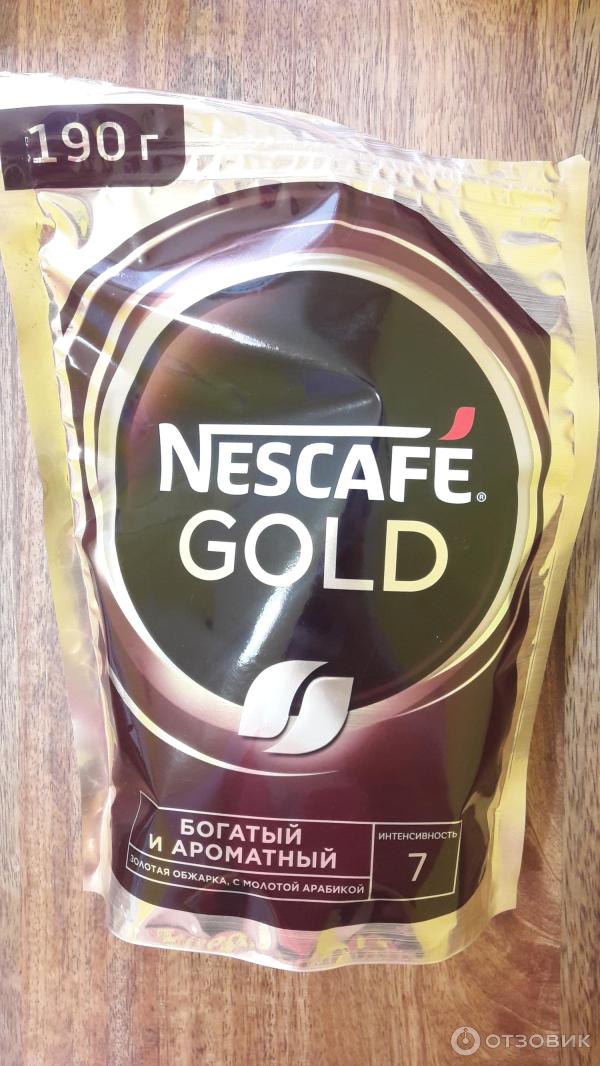 Кофе Nescafe Gold растворимый сублимированный с добавлением натурального жаренного молотого кофе фото