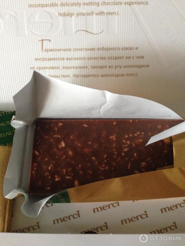 Шоколад молочный Merci с дробленым лесным орехом и миндалем фото